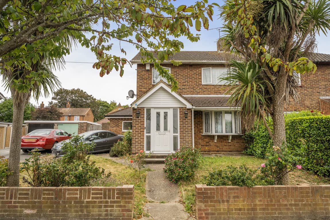 Spacious, individual and full of potential, with a south-facing garden, garage and superb outbuildings